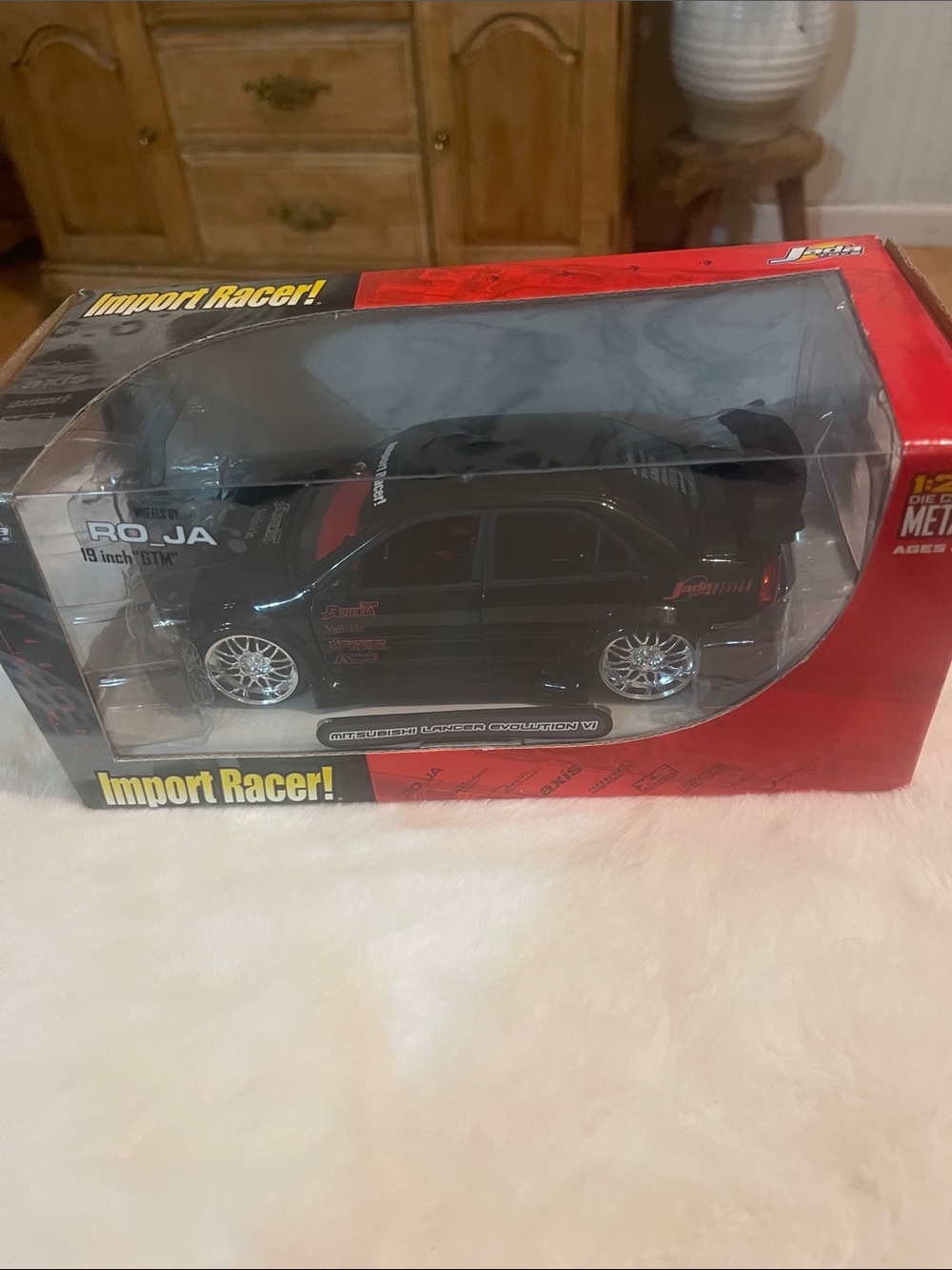 Die-Cast Jada Mitsubishi Lancer Evolution V1 Import Racer